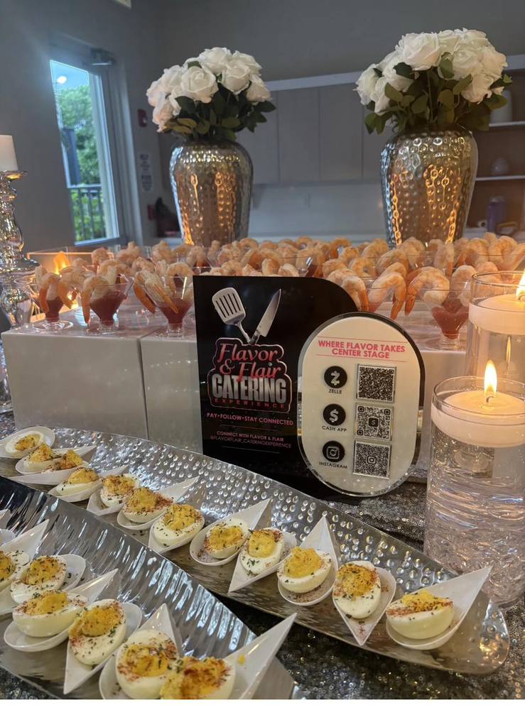 Appetizer and Payment Display Flavor and Flair Catering appetizer display with deviled eggs, shrimp cocktail, and QR codes