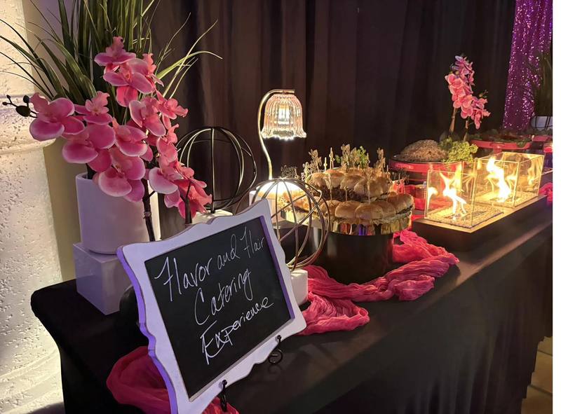 Buffet Sliders and Orchids Flavor and Flair Catering buffet setup with pink orchids, candles, and sliders