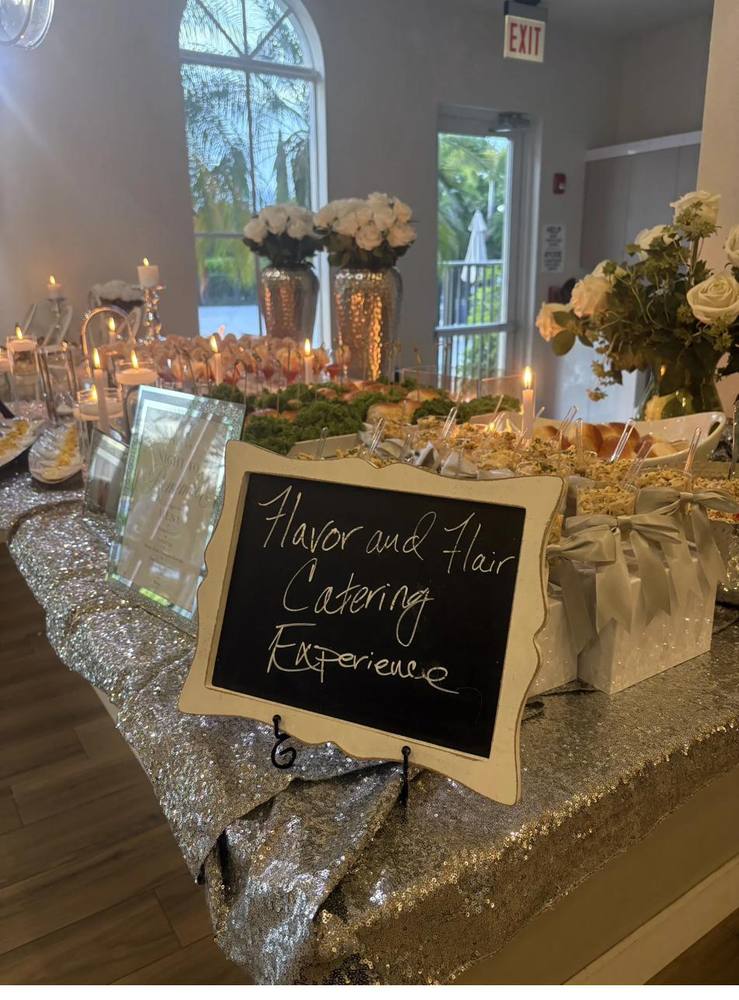 Event Catering Spread Flavor and Flair Catering event spread with silver sequin tablecloth and white roses