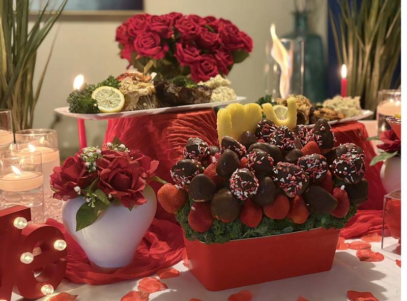 Romantic Strawberry Dessert Display Flavor and Flair Catering private dining with chocolate-covered strawberries and red rose centerpiece