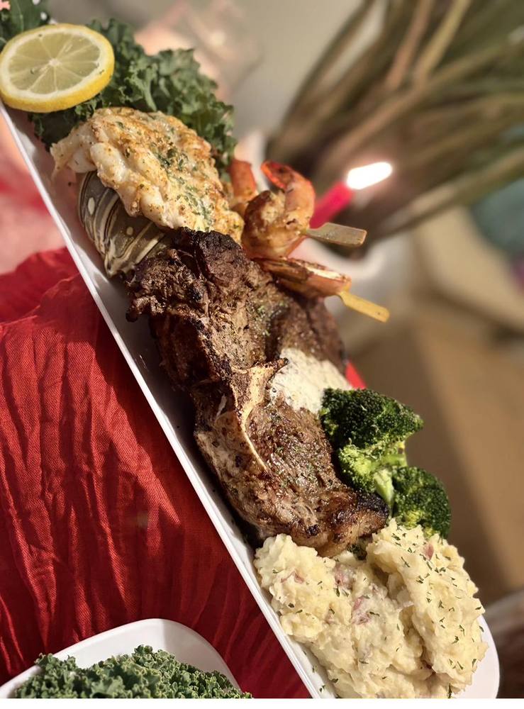 Gourmet Private Dining Flavor and Flair Catering gourmet spread with lobster tail, steak, shrimp skewers, and broccoli