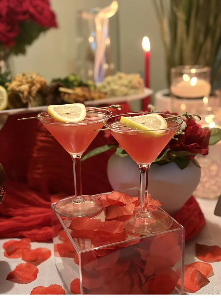 Private Dining Signature Cocktails Flavor and Flair Catering private dinner cocktails with lemon garnish on pedestal display